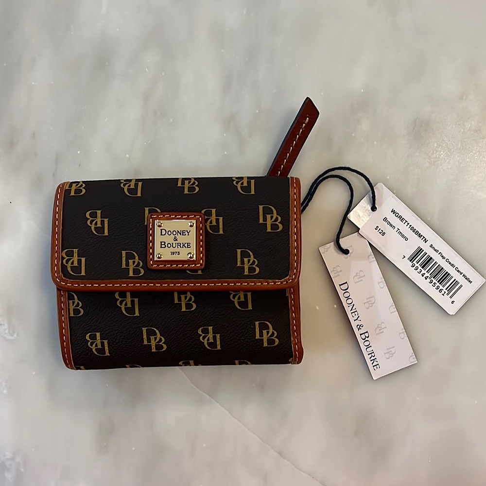 Brand new with tags Dooney and Bourke wallet. Brown and tan